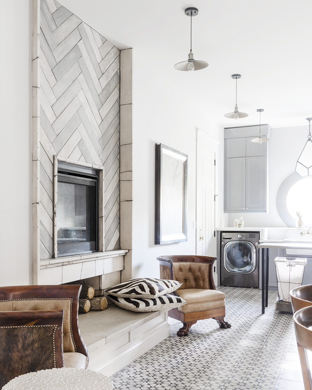 Inviting living room featuring fireplace and kitchen.