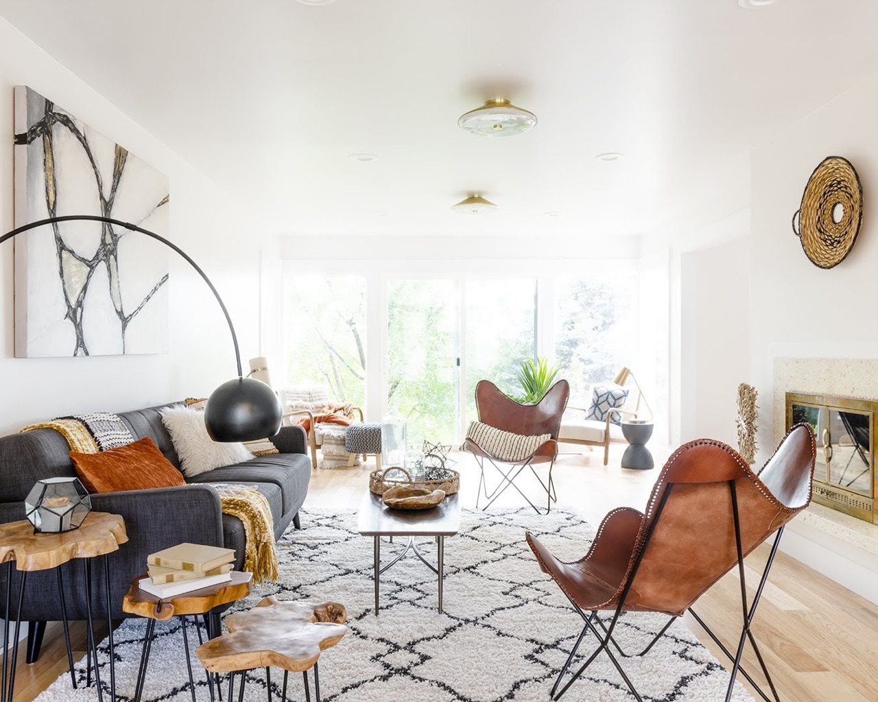 A cozy living room with a patterned rug and comfortable chairs.