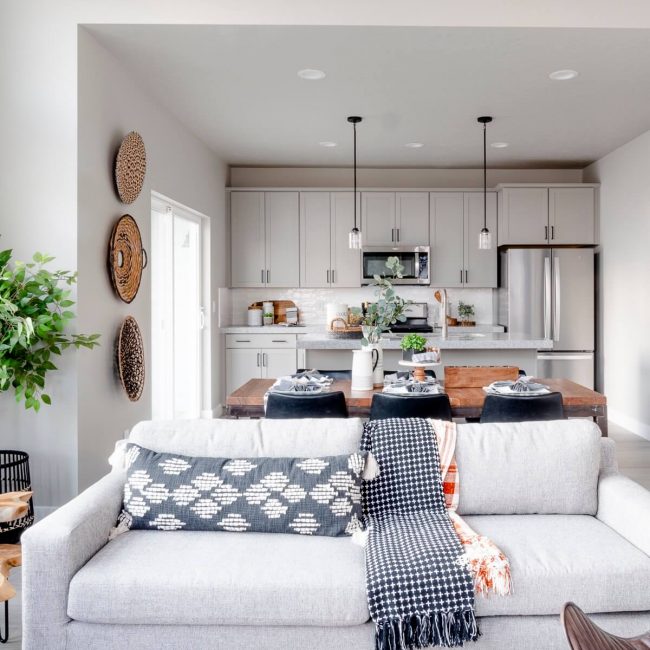 A contemporary living room with a stylish couch, a sleek coffee table, and a cozy rug.