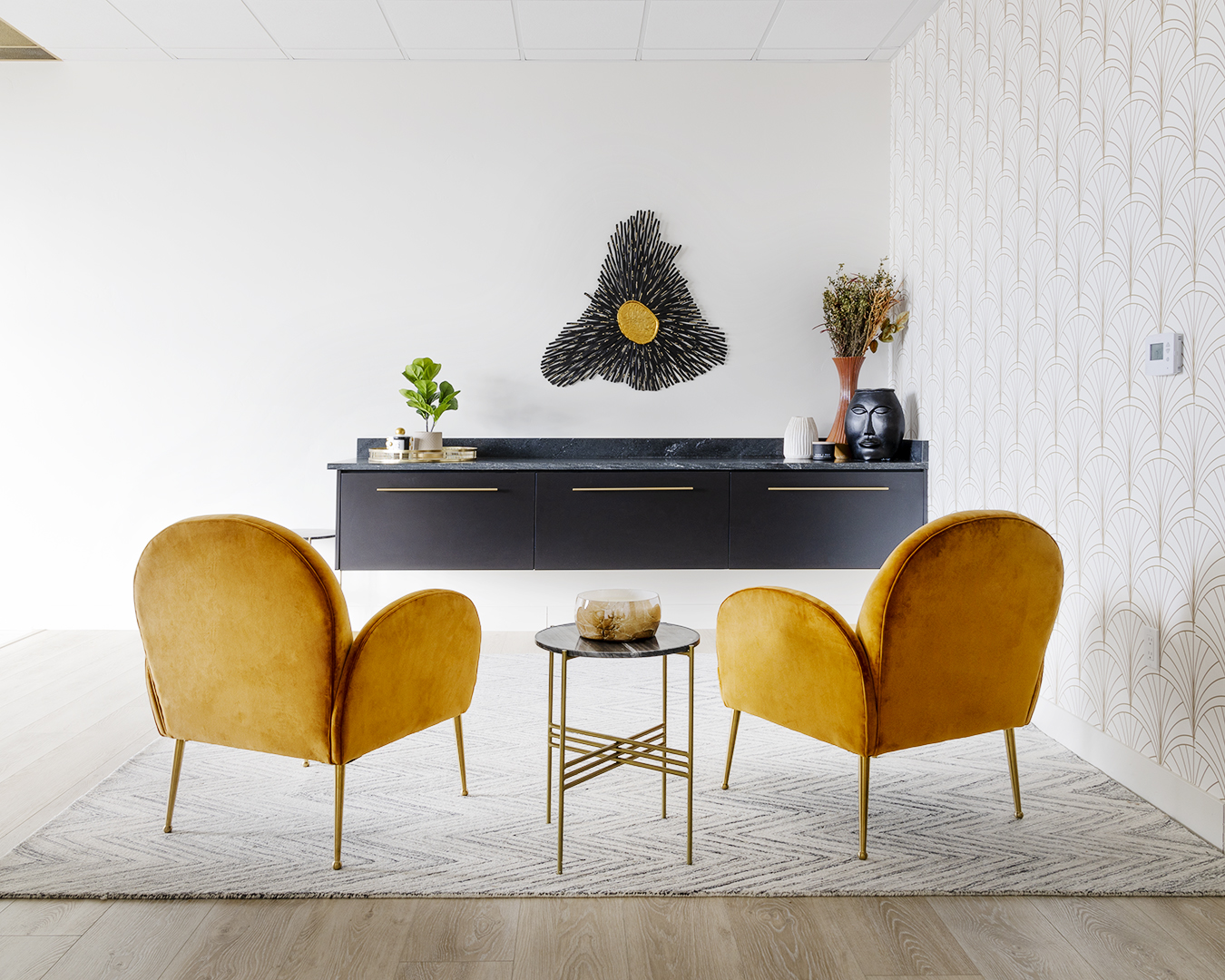 Contemporary office space featuring yellow chairs and a black table.