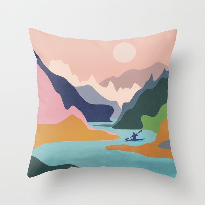 Colorful pillow featuring a mountain scene, perfect for adding a touch of nature to your home decor.