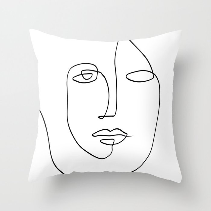 Black and white illustration of a face on a pillow.