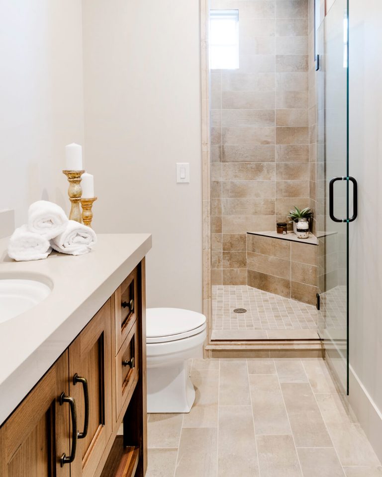 A bathroom with a shower and toilet.