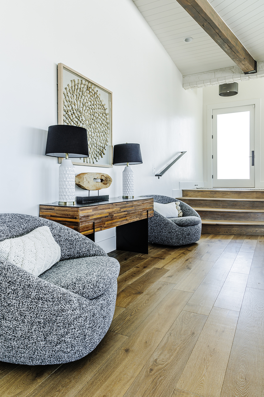 A cozy living room with a sofa and a table.